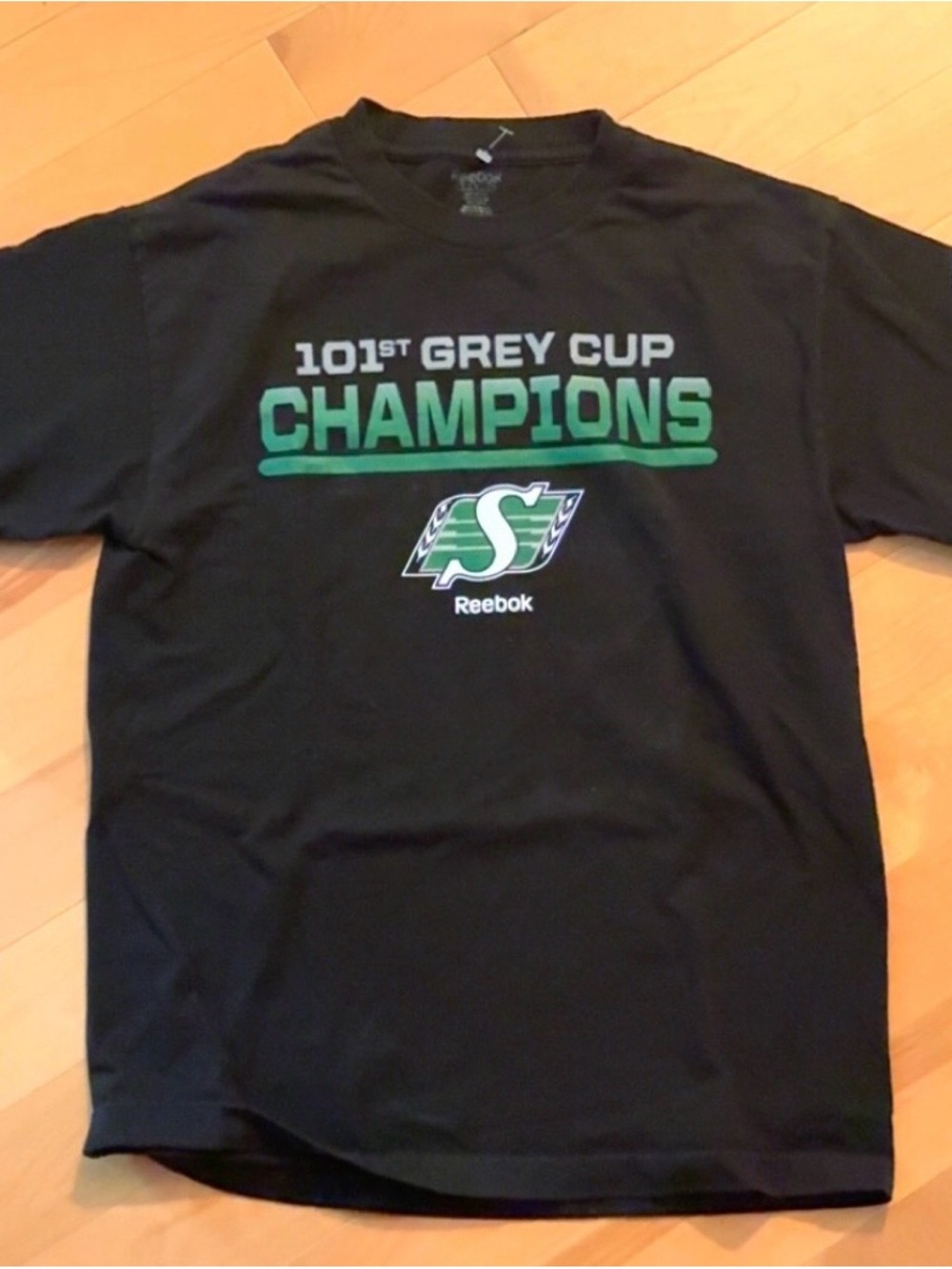 Reebok Black Tee with Roughriders '101st Grey Cup Champions' Graphic